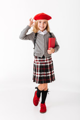 Full length portrait of a cute little schoolgirl
