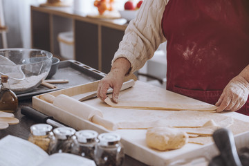 Person cutting dough into strips