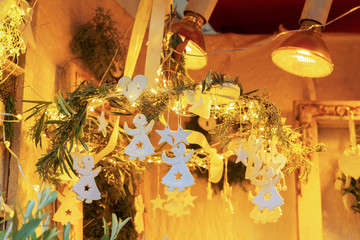 Christmas market kiosk details with hanging angels