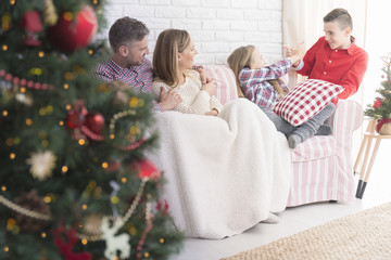 Happy family and christmas tree