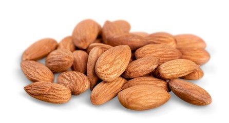 almonds in heap over white background