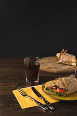 cooked panini on wooden board and plate