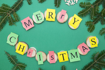 Merry Christmas inscription on a green one-color background