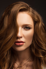 Fototapeta premium portrait of beautiful brown-haired girl looking at camera