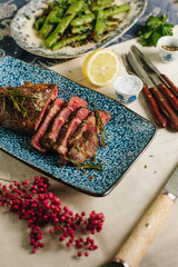 Freshly cooked steak with table setting. Stock Food.