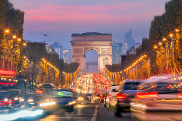 Famous Champs-Elysees and Arc de Triomphe at twilight in Paris