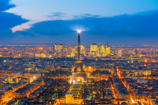 Fototapeta Skyline of Paris with Eiffel Tower at sunset in France