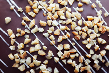 close up of almond topping on chocolate sweet dessert background.