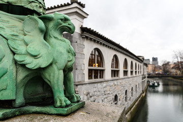 Fototapeta na wymiar Staute of the Dragon Bridge, Ljubljana, Slovenia