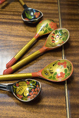 Khokhloma spoons on wooden table