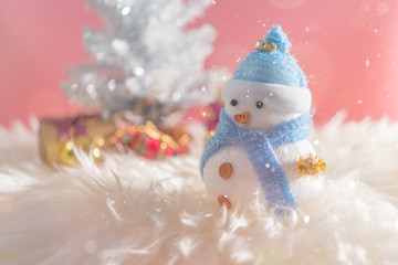 Happy snowman standing in winter christmas snow background. Merry christmas and happy new year greeting card with copy-space. Christmas celebration holiday background.