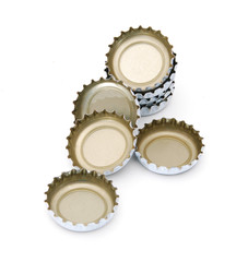 Obraz premium Decorative beer caps on white background