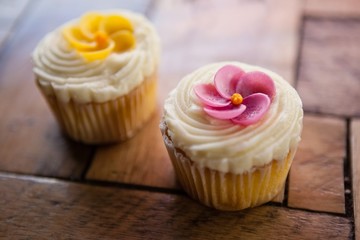 Close up of cupcakes on wooden table