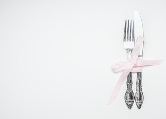 composition by February 14 knife and fork tied with ribbon, place for text, top view