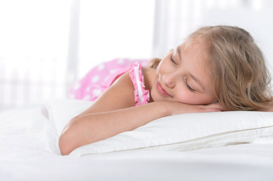 Little Girl Sleeping In Bed