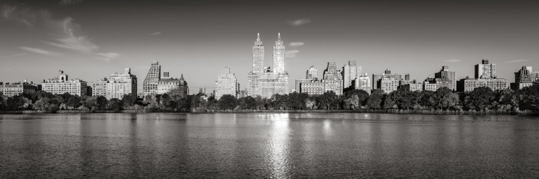 Sunrise on the Upper West Side with view of the Central Park Reservoir in Black & White (panoramic). Manhattan, New York City
