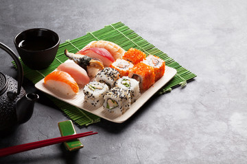 Set of sushi, maki and green tea
