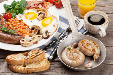 English breakfast. Fried eggs, sausages, bacon