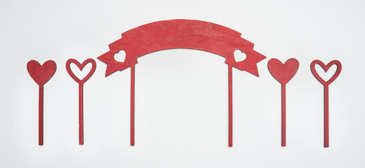 composition on the day of the holy valentine, hearts on sticks, on a white background, top view