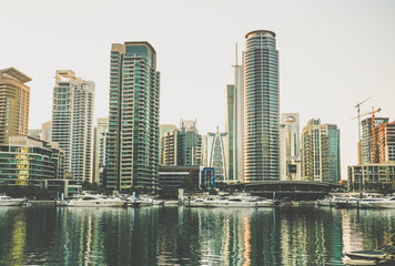 Fototapeta na wymiar Dubai. The waterfront of Dubai Marina in the early morning. Toning instagram. 