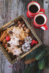 Two cups of coffee and Christmas cinnamon cookies in basket