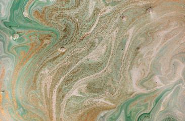 Marble abstract acrylic background. Nature green marbling artwork texture. Golden glitter.