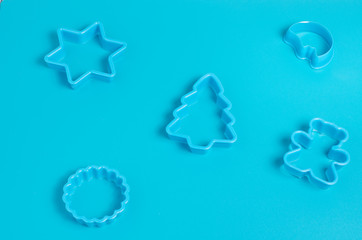 Plastic cookie cutter on a blue background