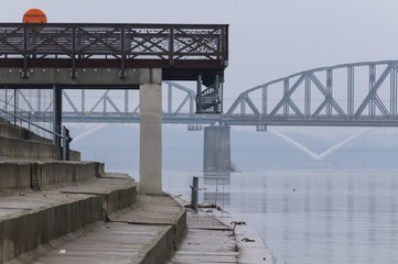 Torun, Poland, Ernest Malinowski Railway Bridge on Vistula River with ramp on first plan