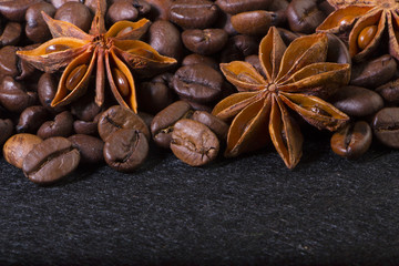 star anise, on the background of coffee with beautiful highlights on the surface of grains