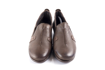 Female brown leather shoe on white background, isolated product, comfortable footwear.