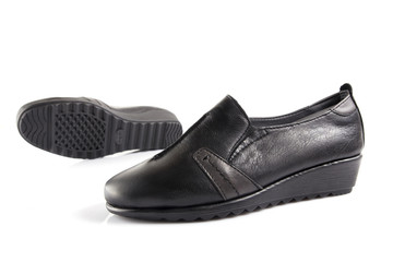 Female black leather shoe on white background, isolated product, comfortable footwear.