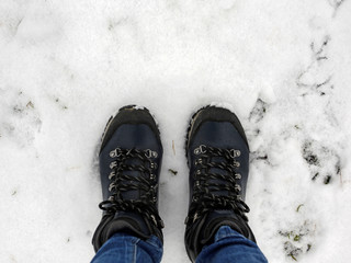 winter hiking shoes on the snow, top view