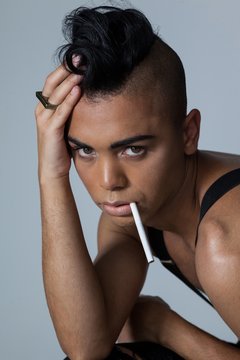 Portrait of transgender woman with cigarette