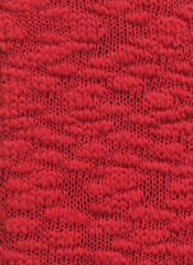 Red knit fabric for the background.Decorative material from boucle yarn