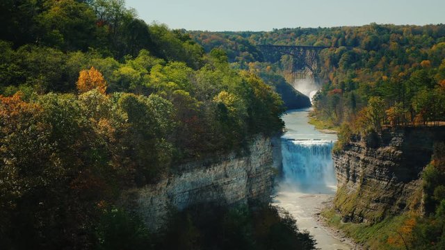 Grand Canyon of the East, the most beautiful and famous parks in America - Letchworth State Park. A beautiful waterfall is visible in the distance