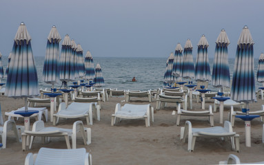 Swimming man in evening