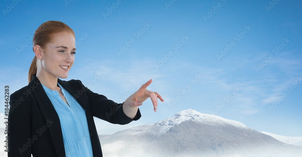 Poster Businesswoman touching air with snow mountains