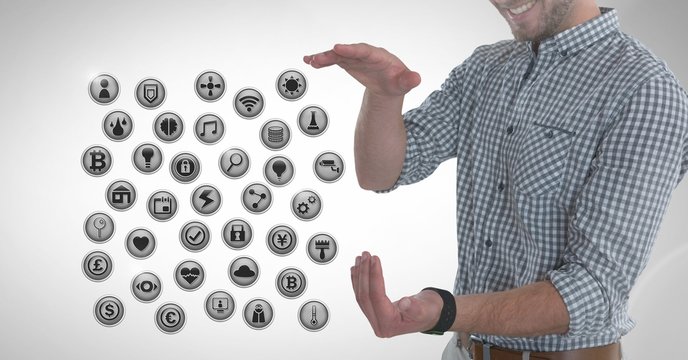 Various app icons and Businessman with hands palm open in city