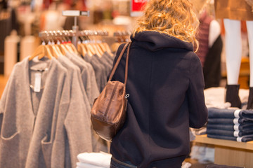 young woman clothes shopping