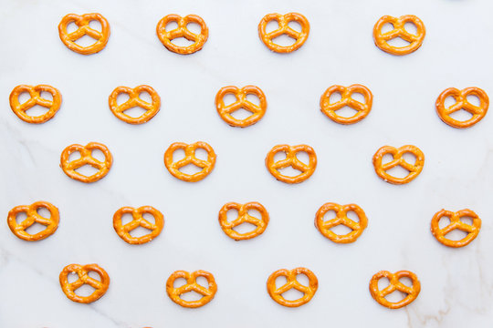 Mini pretzels on white background