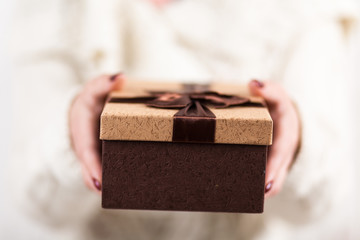 Present box in woman's hands