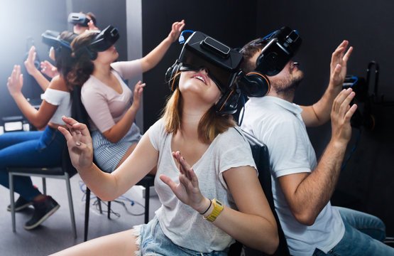 People having fun with vr headset goggles