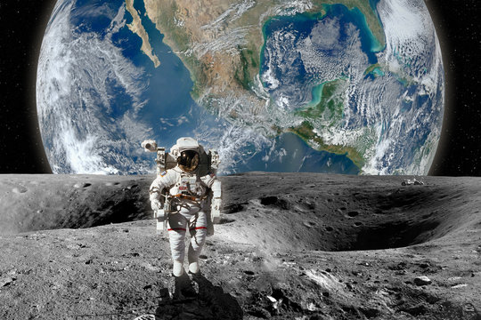Fototapeta Astronaut on the Moon. Planet earth in background. Elements of this image furnished by NASA