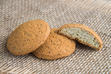 Stack of freshly baked oat biscuits on the background of burlap