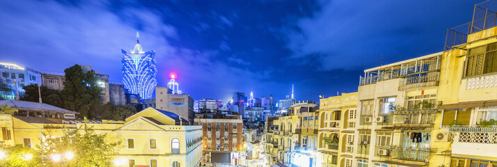 Macau skyline with old and modern buildings at night