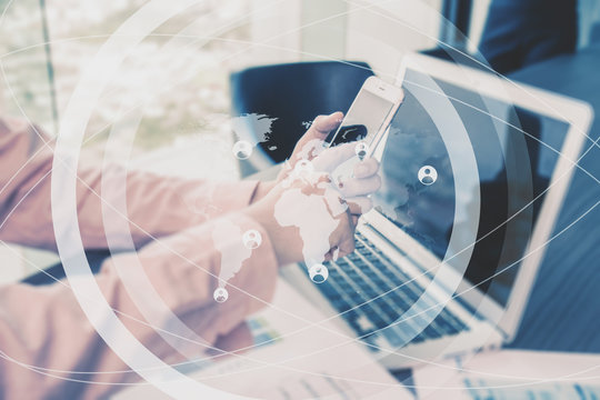 Casual dressed man using telephone and laptop with world map and circles.