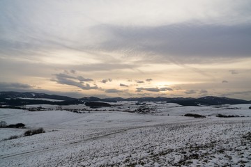 Sunset on meadow with snow during winter. Slovakia