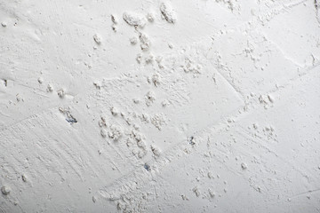 Abstract background of plaster on black wall. Copy space.