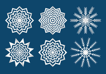 White paper cuted Christmas snowflakes pack isolated on blue background. Vector illustration