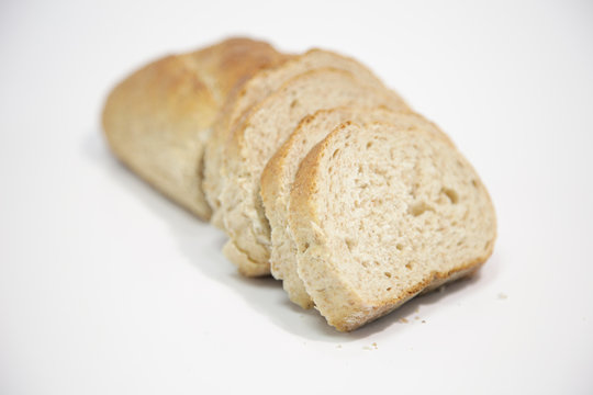 Close-up of sliced bread on white background